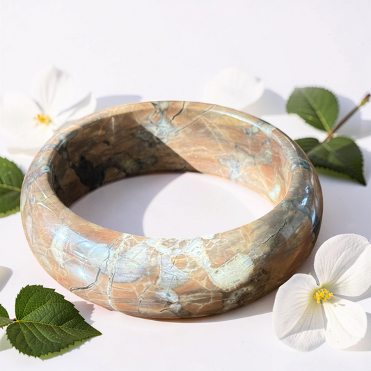 Brown flower Agate stone bangle with white flowers and green leaves on a light background