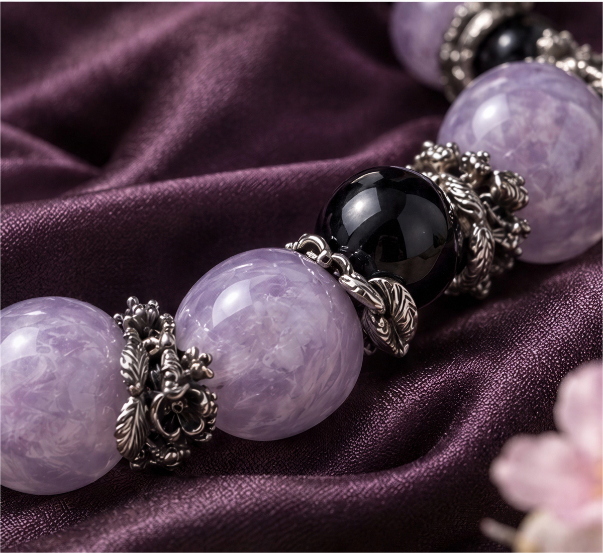 Amethyst and Fire Quartz bracelet displayed in an open box with a dangling silver-tone cross charm.