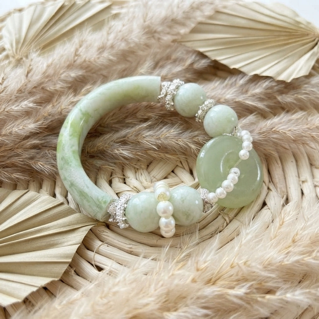 Nephrite jade and pearl bangle bracelet on woven rattan with dried botanicals