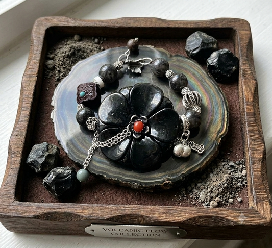 Volcanic Flow Obsidian Flower Charm Bracelet held in hand showing full detail