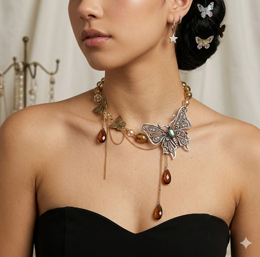 Woman wearing a butterfly-themed necklace and earrings with a blurred background