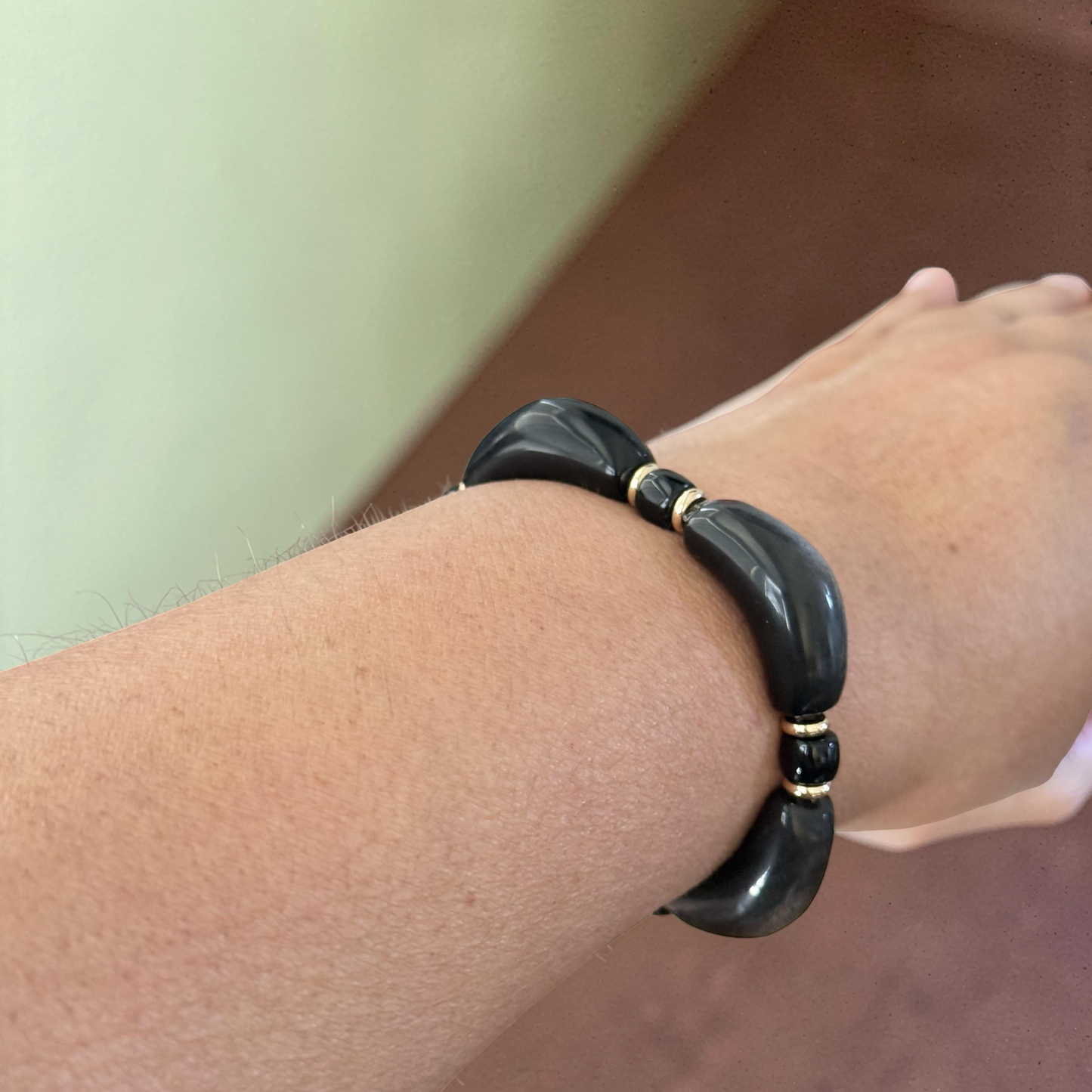 Silver Obsidian Bracelet flat lay with fern and gemstone